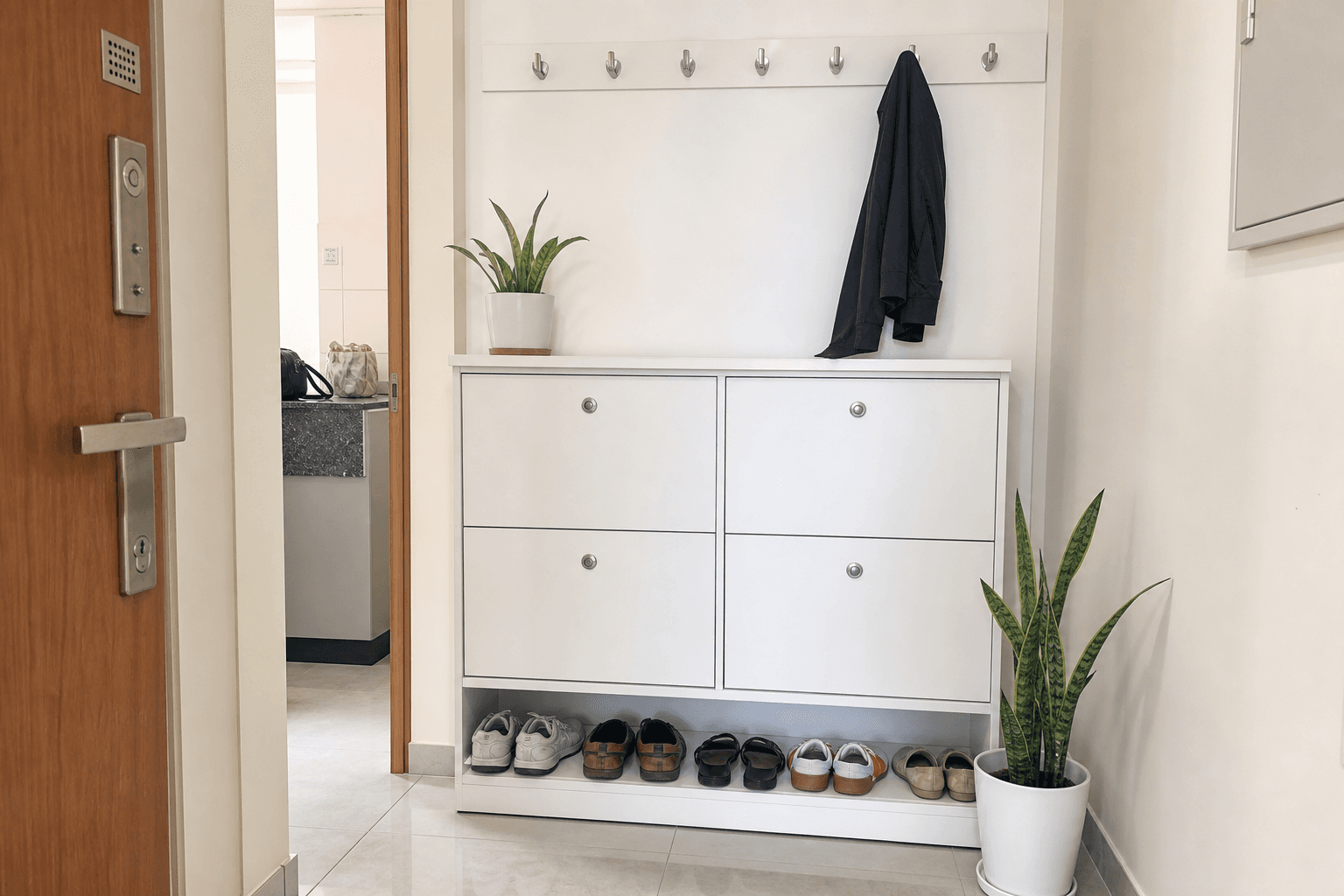 Compact shoe rack with drawer and coat hooks in a narrow Bangalore apartment entry