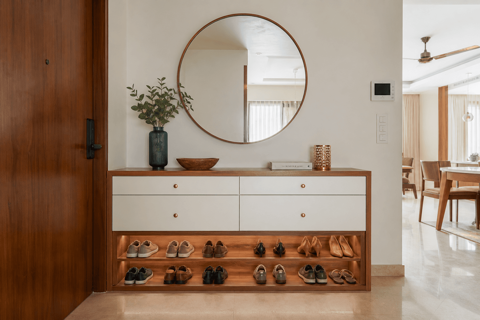 Built-in shoe cabinet integrated with console table in a contemporary Indian apartment