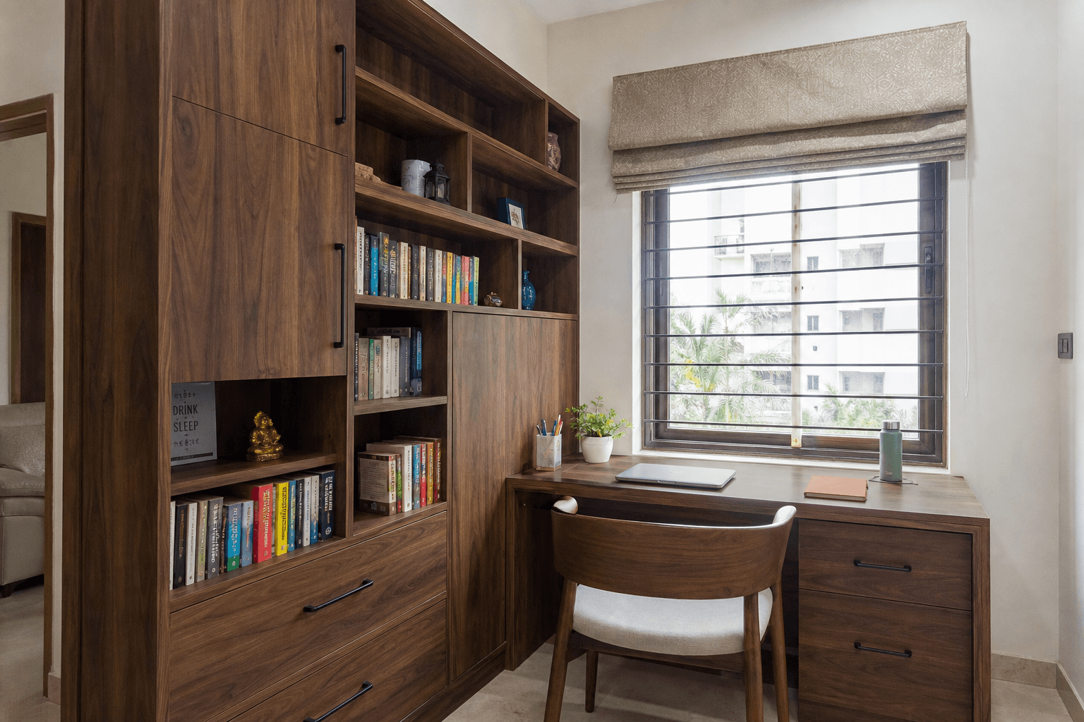 Corner study unit with tall bookshelf and task lighting in a Bangalore apartment