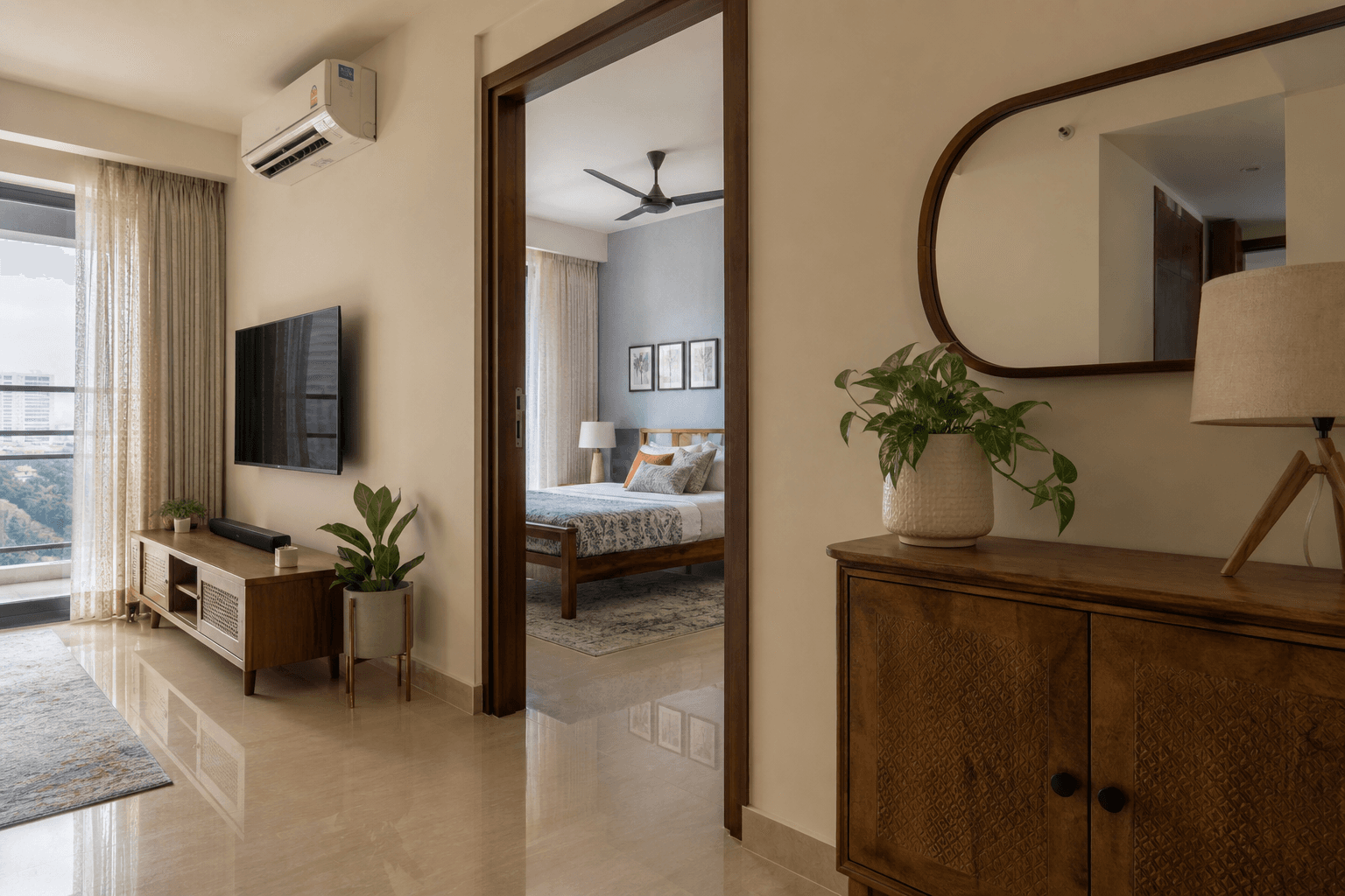 Connected living and bedroom view showing cohesive finishes in an Indian apartment