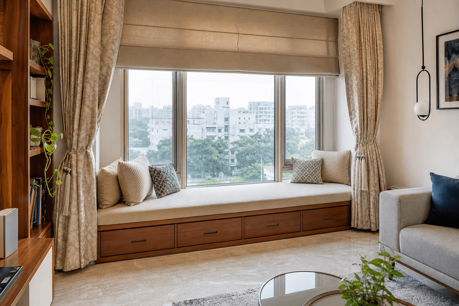 Window seat with built-in storage in a contemporary Indian apartment