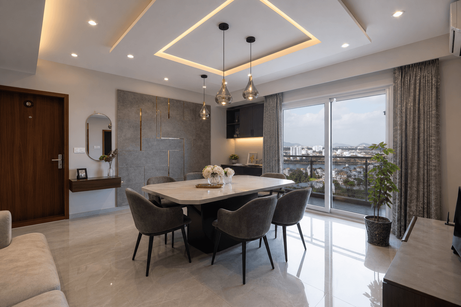 Dining area with geometric false ceiling design and pendant lights in Vijayawada