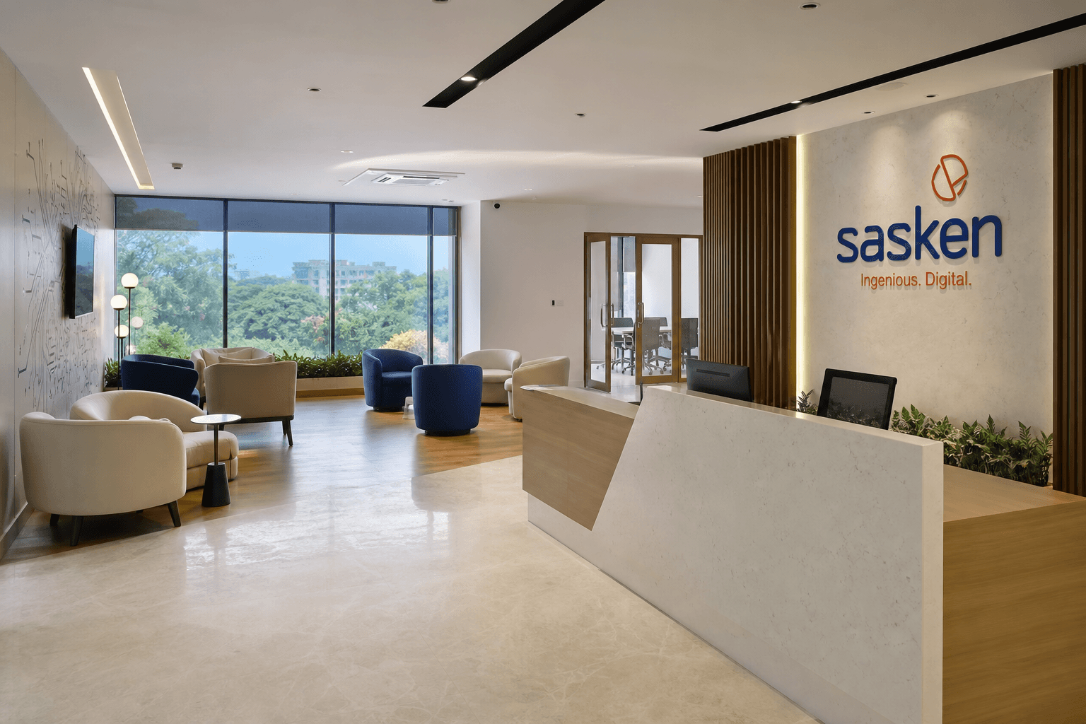 Corporate reception lobby with branded wall and seating in an Indian office building
